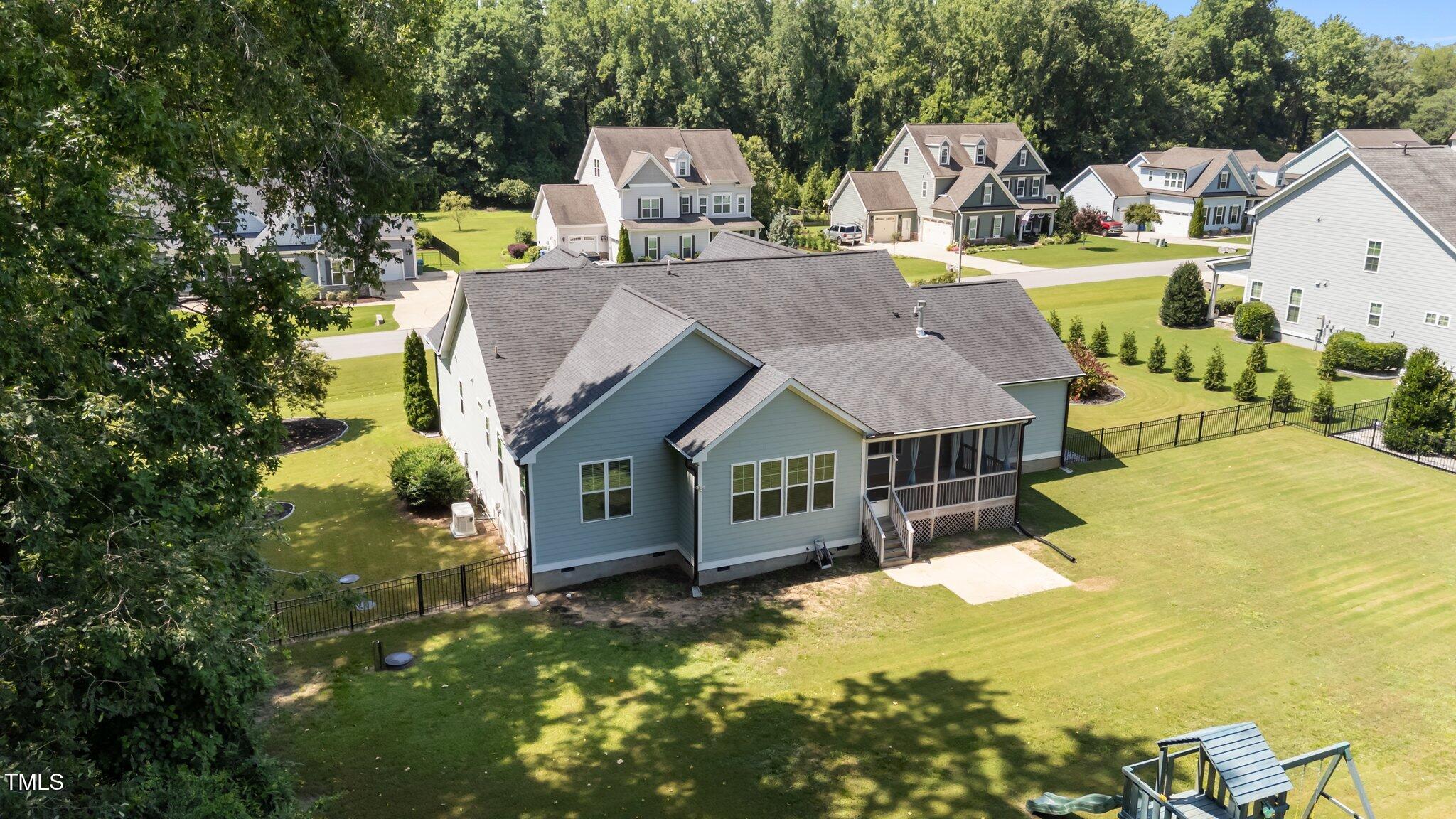 4125 Olde Judd Drive Willow Spring, NC 27592 - Photo 47 of 48 an aerial view of a house with swimming pool and large trees