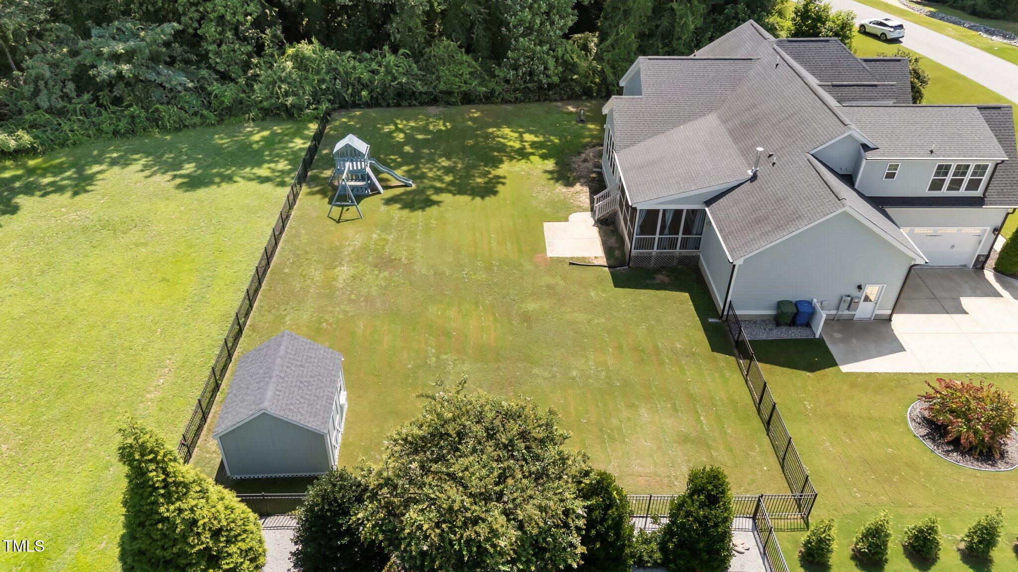 4125 Olde Judd Drive Willow Spring, NC 27592 - Photo 48 of 48 a view of a swimming pool with a patio