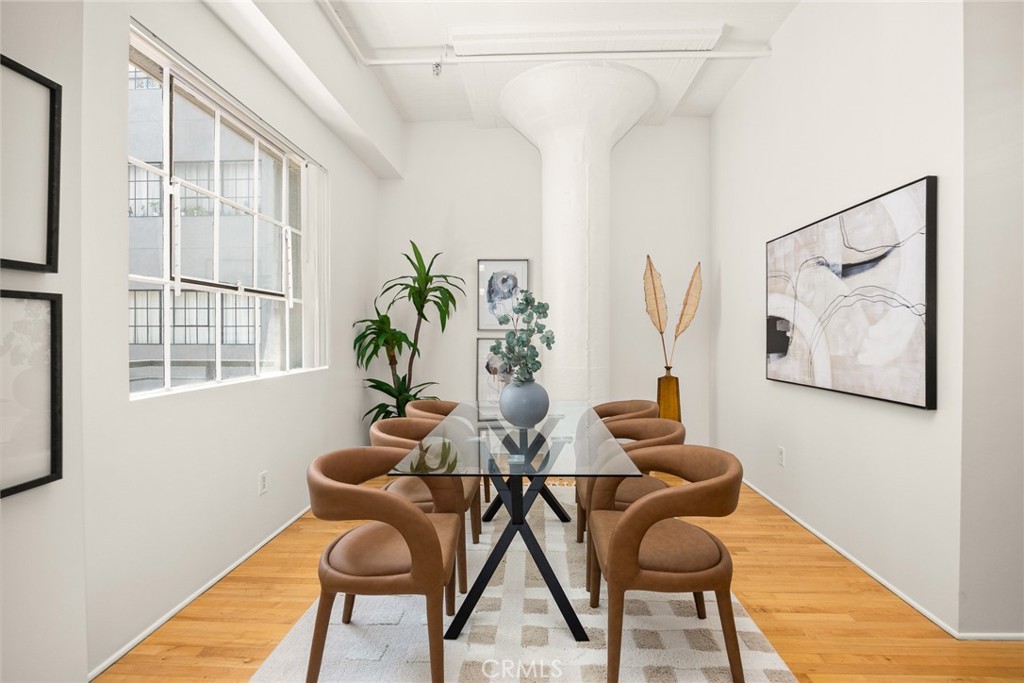 420 San Pedro Street, Unit 427 Los Angeles, CA 90013 - Photo 12 of 42 a dining room with furniture and wooden floor