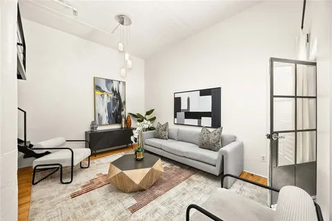 a living room with furniture and a window