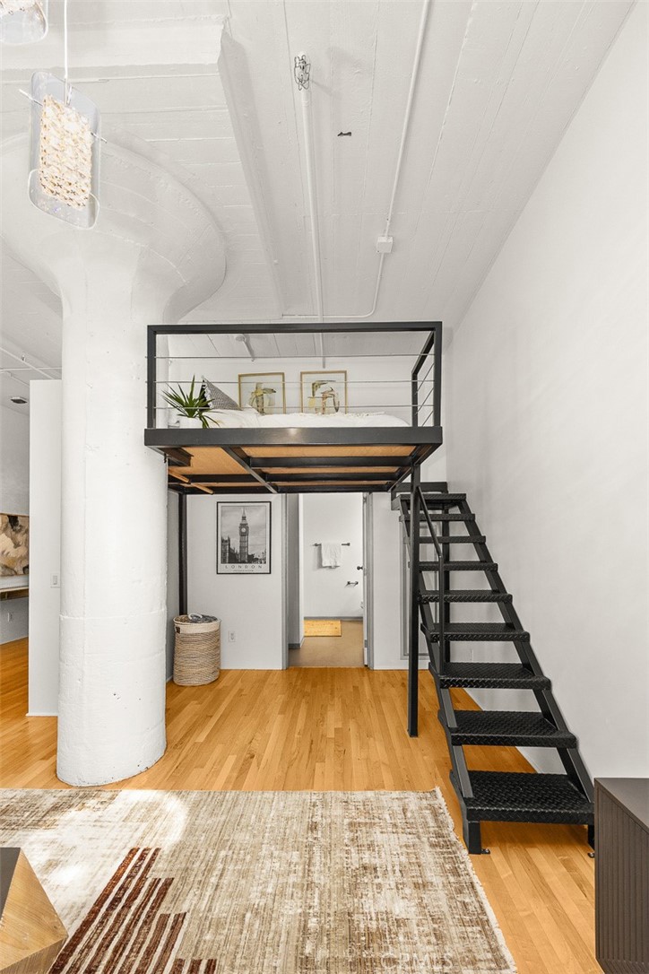 420 San Pedro Street, Unit 427 Los Angeles, CA 90013 - Photo 16 of 42 a very nice looking room with wooden floor and furniture