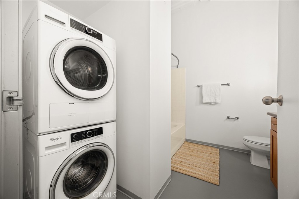 420 San Pedro Street, Unit 427 Los Angeles, CA 90013 - Photo 20 of 42 a view of a hallway with washer and dryer