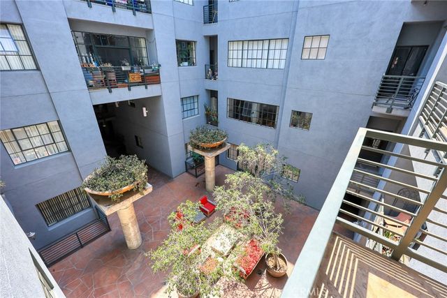 a front view of a house with outdoor seating