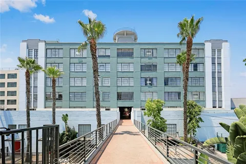 a view of a building with potted plants