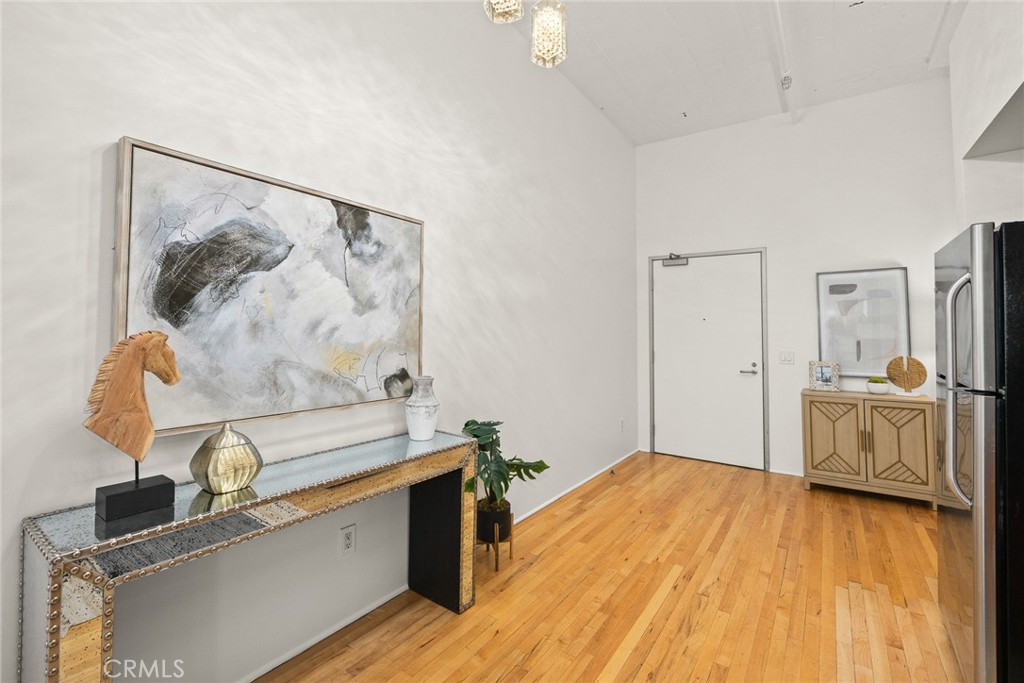 420 San Pedro Street, Unit 427 Los Angeles, CA 90013 - Photo 7 of 42 a view of a kitchen with sink and wooden floor