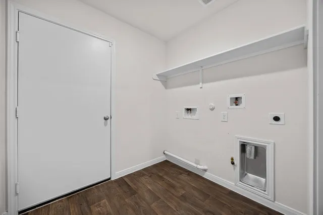 a bathroom with a sink toilet and a mirror