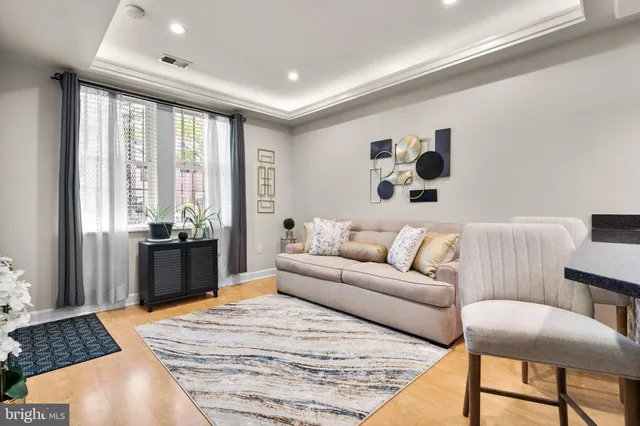 a living room with furniture and a rug