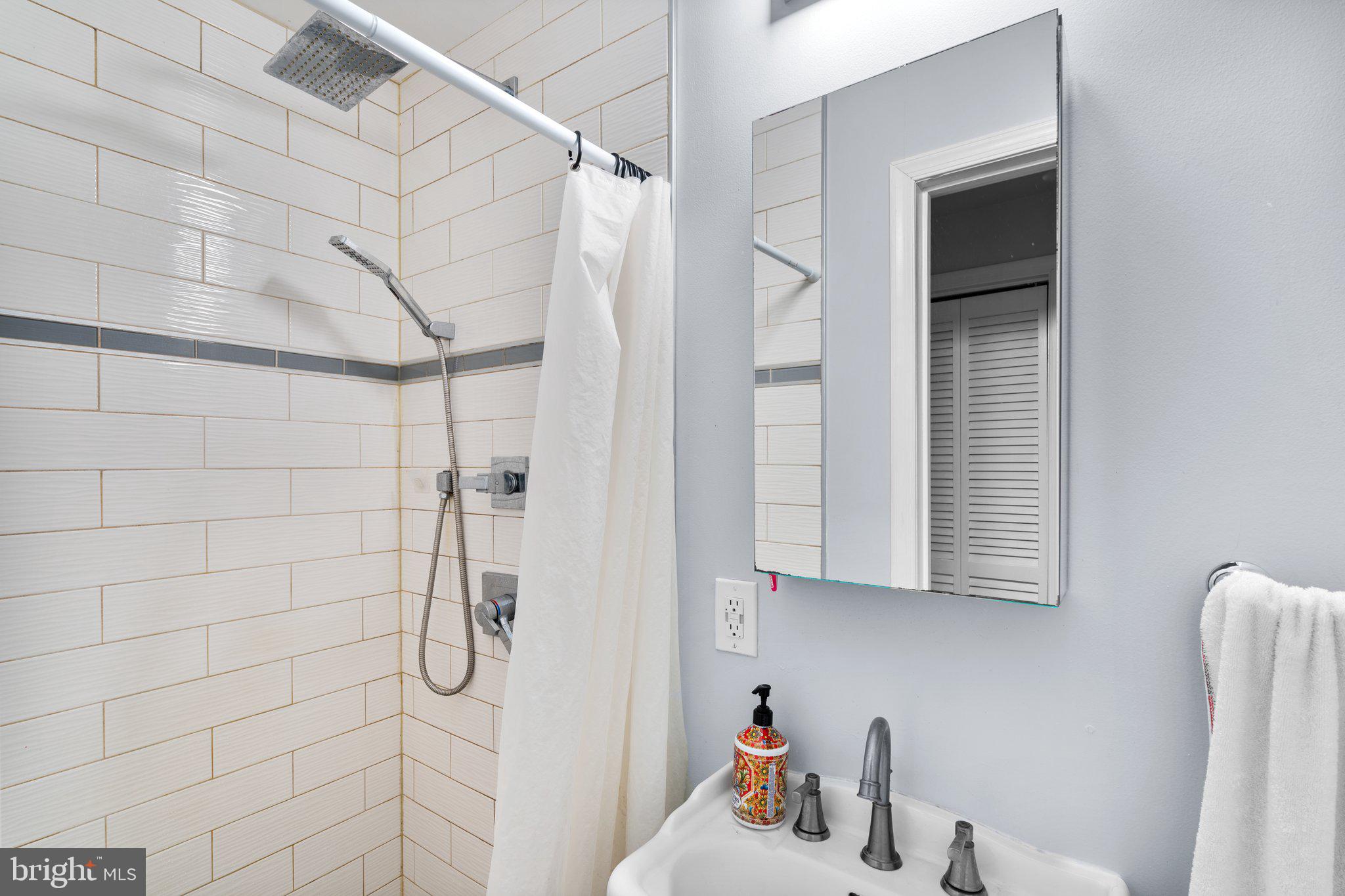 1658 West Virginia Avenue Northeast, Unit 101 Washington, DC 20002 - Photo 21 of 29 a bathroom with a shower