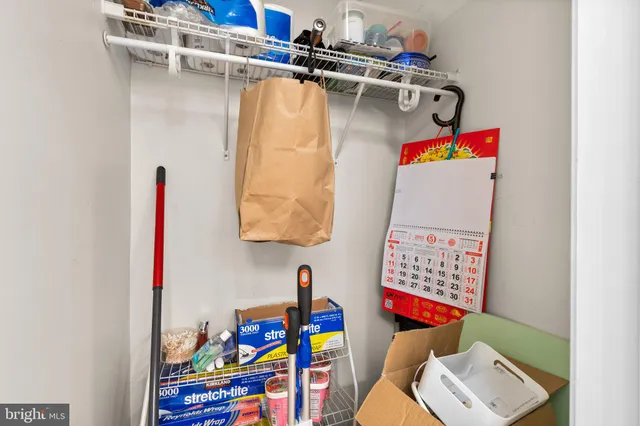 a view of bathroom with a sink and mirror