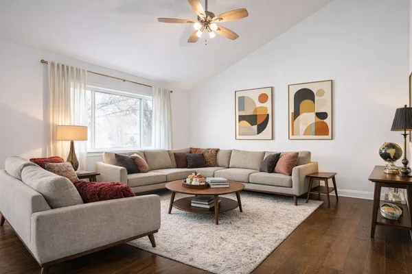 a living room with furniture and a large window