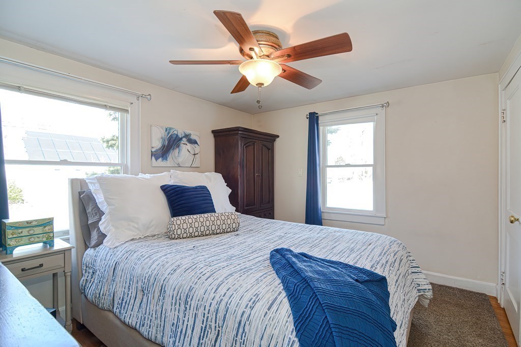 35 Colasanti Road Weymouth, MA 02191 - Photo 14 of 39 a bedroom with a large bed and a large window