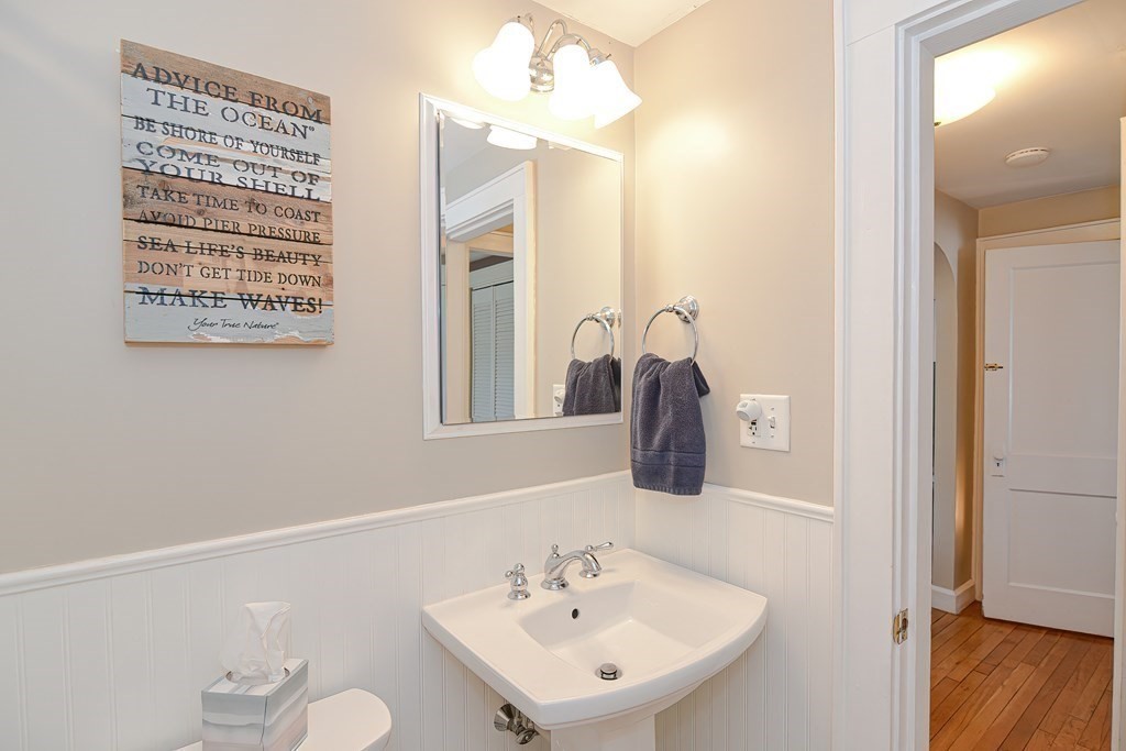 35 Colasanti Road Weymouth, MA 02191 - Photo 19 of 39 a bathroom with a sink a vanity and a mirror