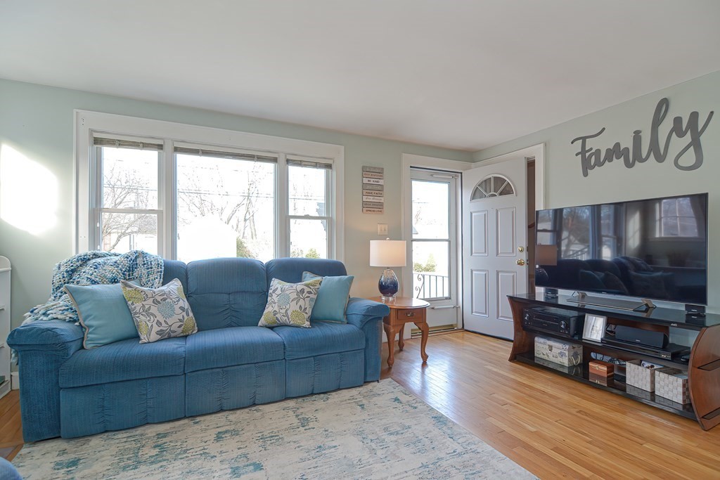 35 Colasanti Road Weymouth, MA 02191 - Photo 7 of 39 a living room with furniture and a flat screen tv