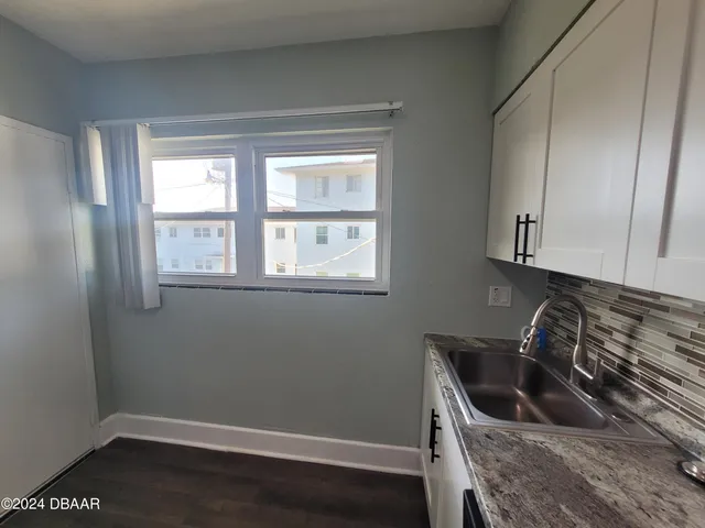 a white refrigerator freezer sitting in a kitchen