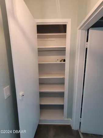 a bathroom with a toilet a sink and a window