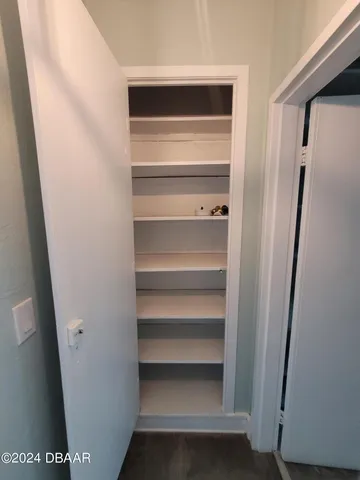 a bathroom with a toilet a sink and a window