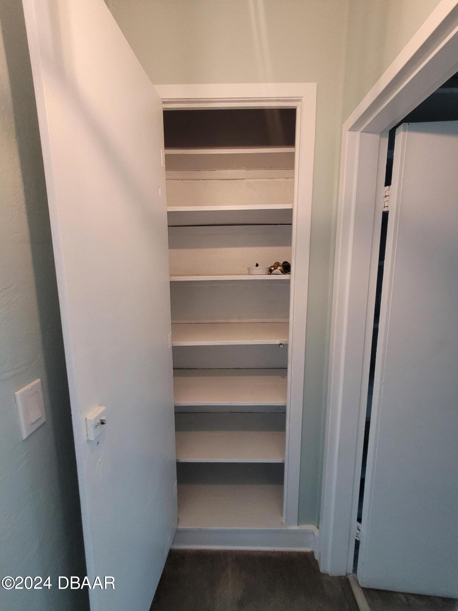 500 South Beach Street, Unit J4 Daytona Beach, FL 32114 - Photo 24 of 36 a view of walk in closet with empty racks