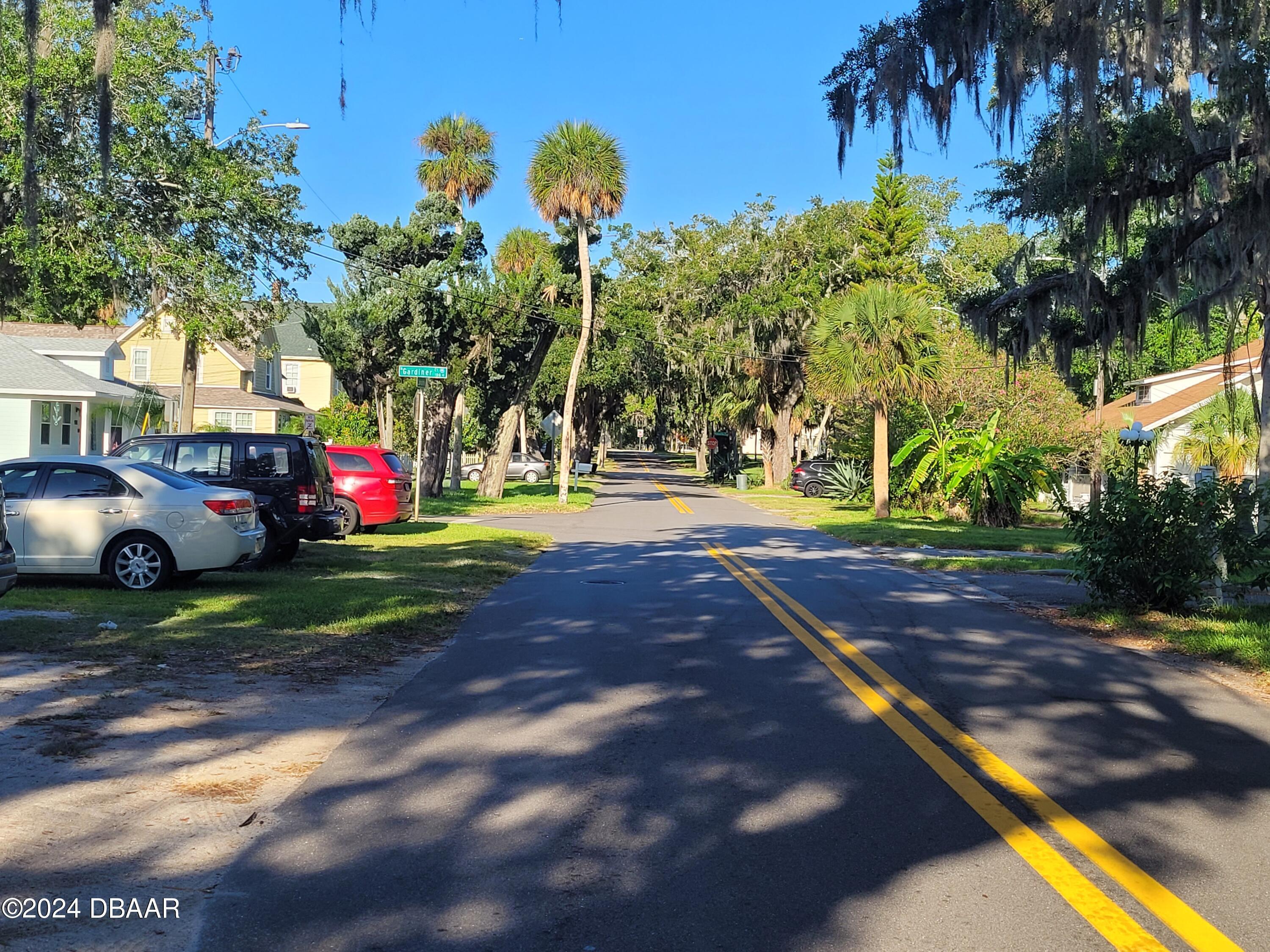 500 South Beach Street, Unit J4 Daytona Beach, FL 32114 - Photo 32 of 36 a view of street with tall trees