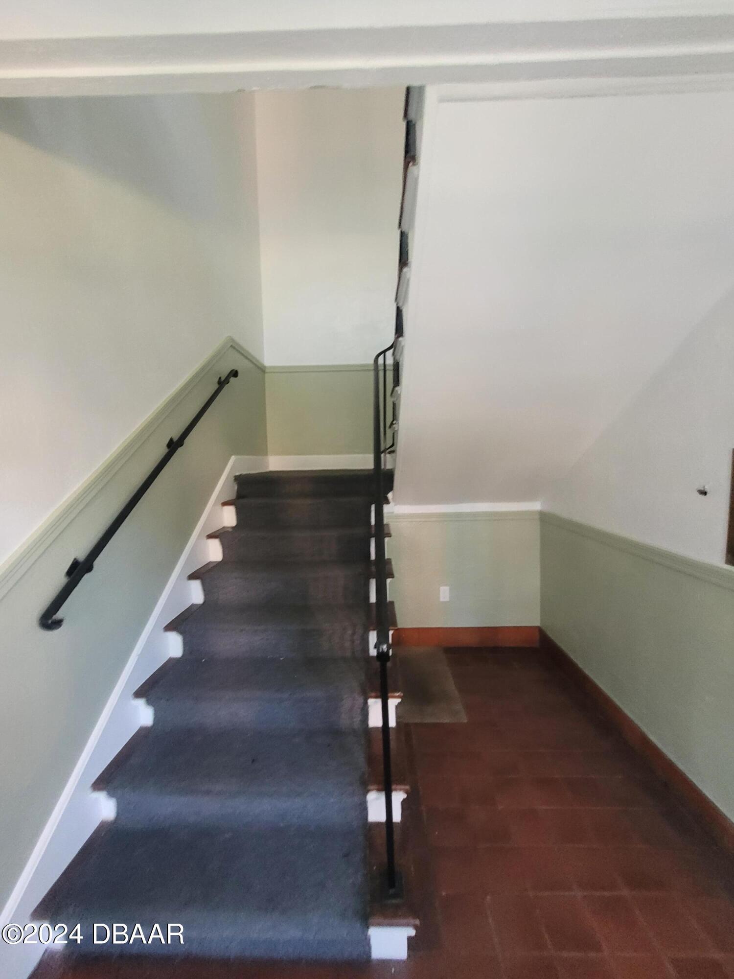 500 South Beach Street, Unit J4 Daytona Beach, FL 32114 - Photo 7 of 36 a view of entryway with stairs