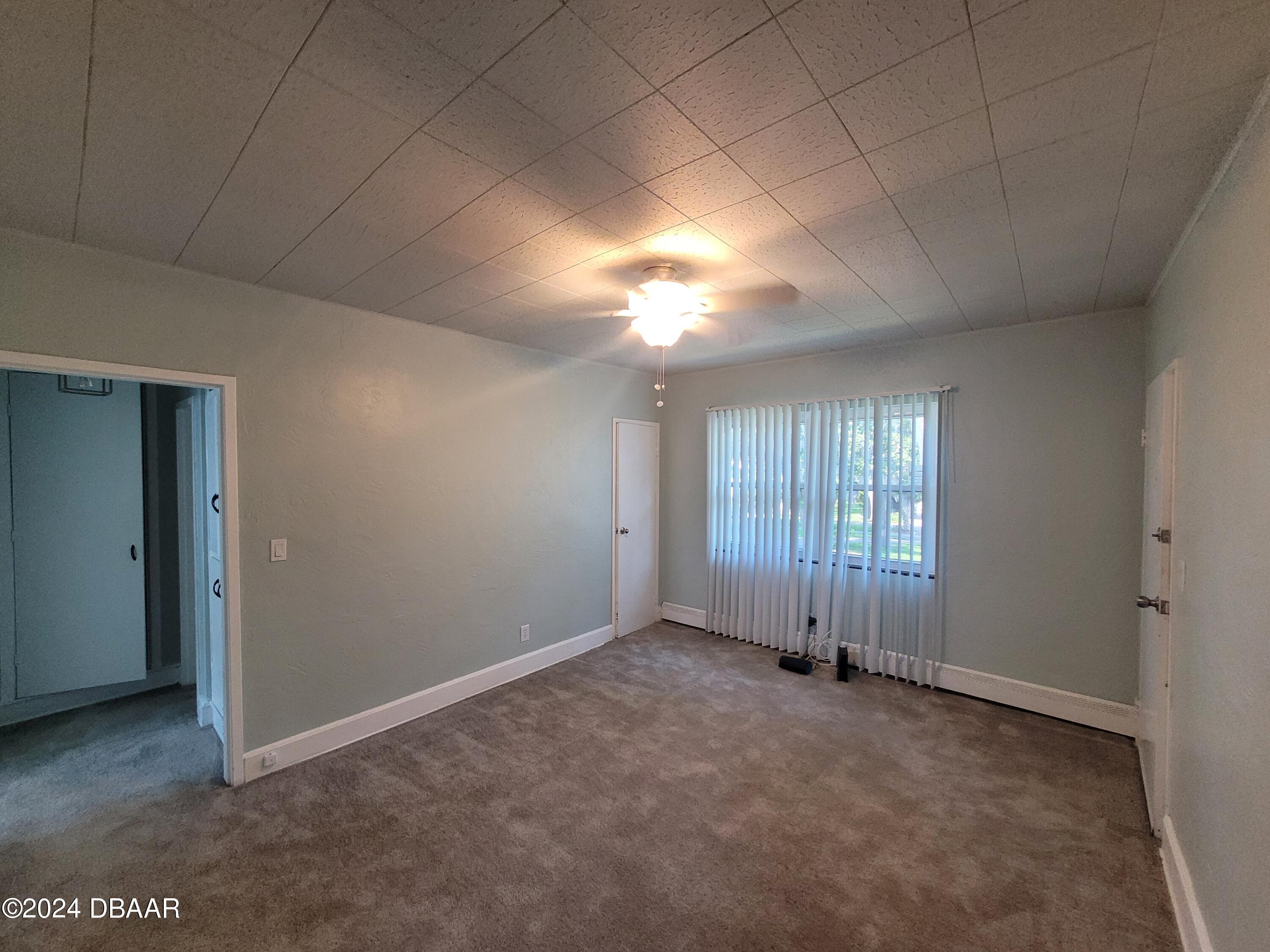 500 South Beach Street, Unit J4 Daytona Beach, FL 32114 - Photo 10 of 36 a view of an empty room with a window