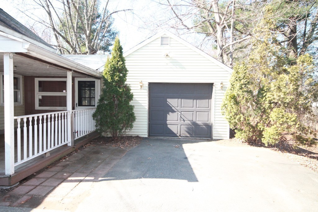 280 Dwight Road Springfield, MA 01108 - Photo 2 of 21 a front view of a house with a yard and garage