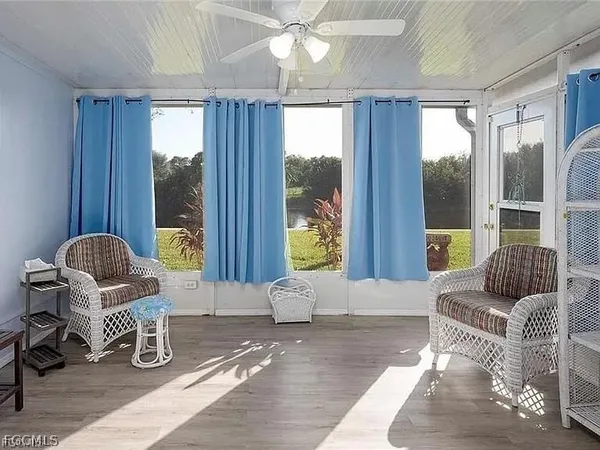 a living room with furniture and window