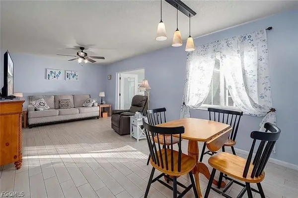 a view of a livingroom with furniture and a chandelier