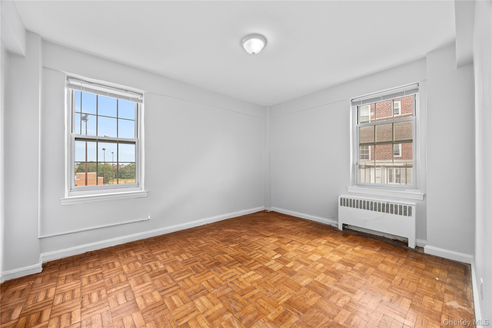 210 Pelham Road, Unit 5M New Rochelle, NY 10805 - Photo 2 of 26 an empty room with a window
