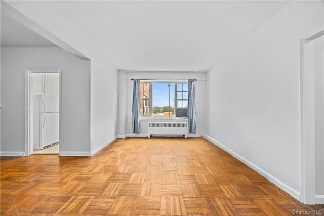 a view of an empty room and window