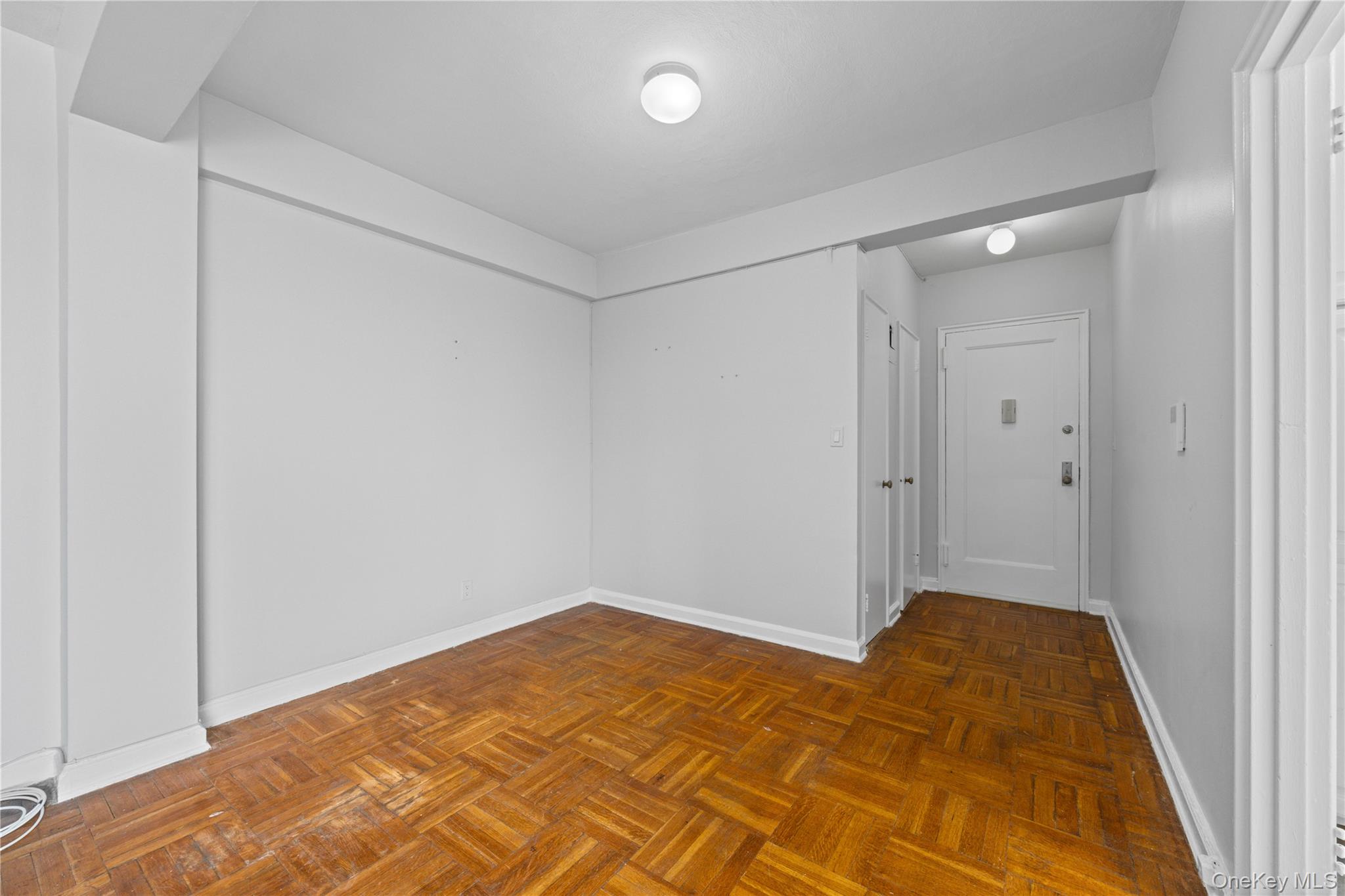 210 Pelham Road, Unit 5M New Rochelle, NY 10805 - Photo 6 of 26 a bedroom with a bed and a shower
