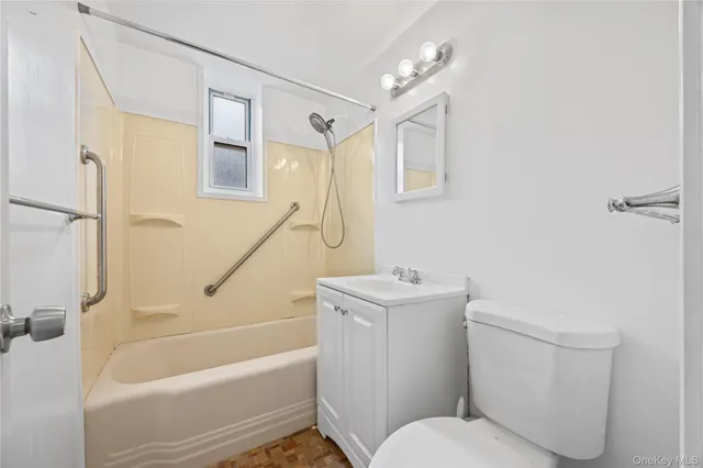 a bathroom with a toilet and a bathtub