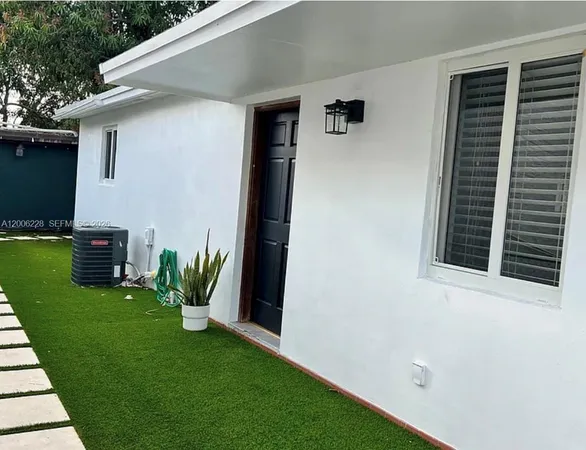 a backyard of a house with seating space