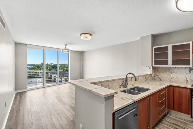 a kitchen with a sink and large window
