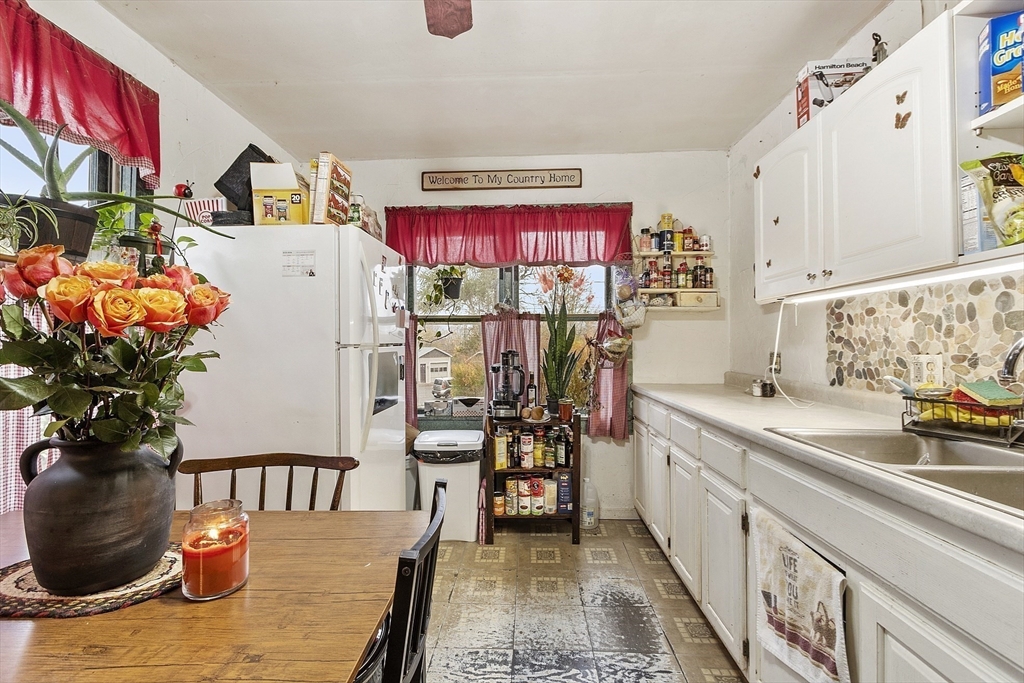 31 Kelton Street Athol, MA 01331 - Photo 2 of 25 a view of a kitchen with furniture and a potted plant