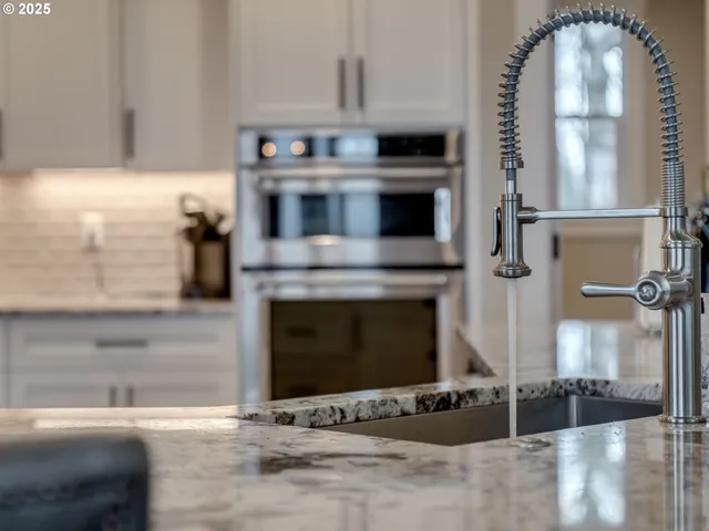 a kitchen with a stove and a microwave