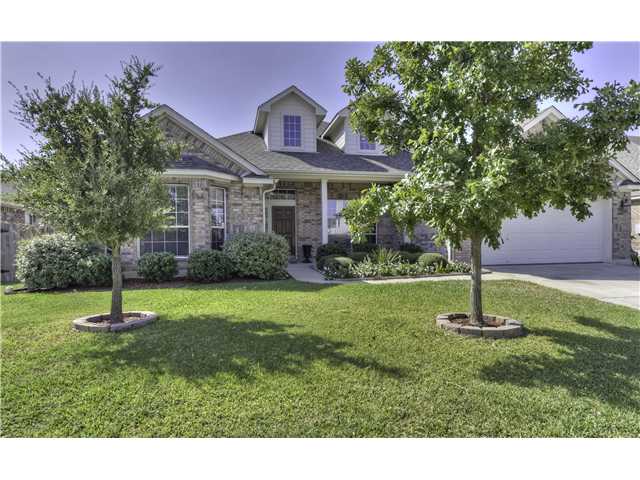 1008 Canyon Maple Road Pflugerville, TX 78660 - Photo 1 of 1 a front view of a house with a yard