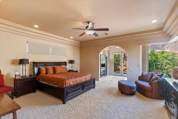a bedroom with a bed and couch