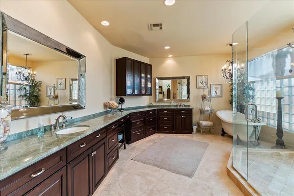 a bathroom with a bathtub and shower