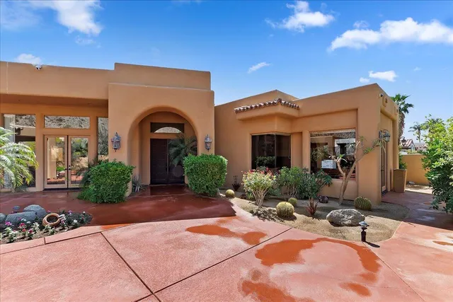 a view of a building with potted plants