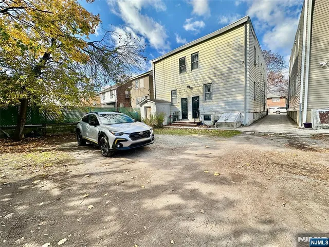 a car parked in front of a house