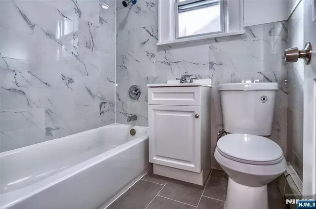 a bathroom with a sink toilet and bathtub
