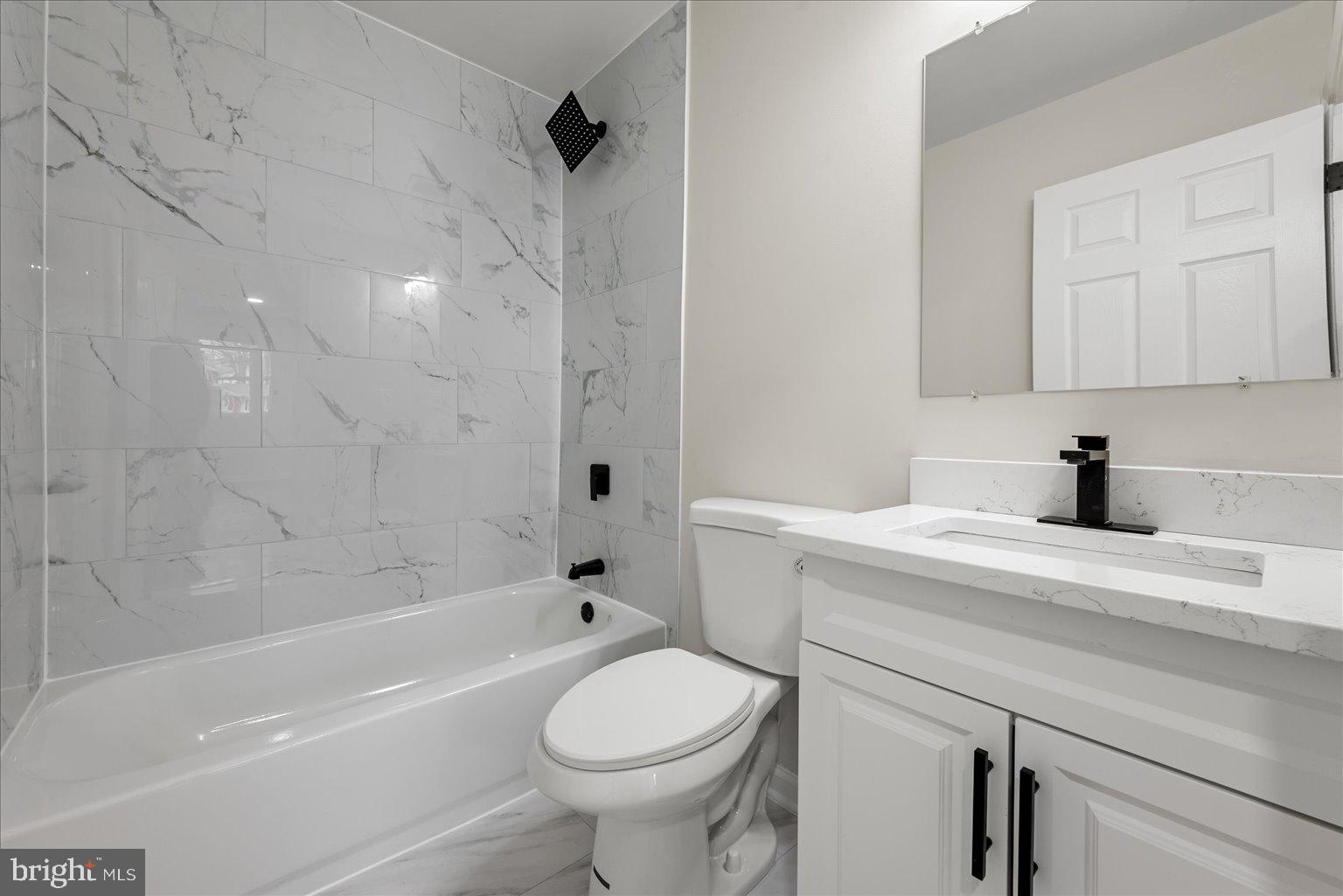 7931 Russell Road Alexandria, VA 22309 - Photo 11 of 16 a bathroom with a sink a toilet and a bathtub