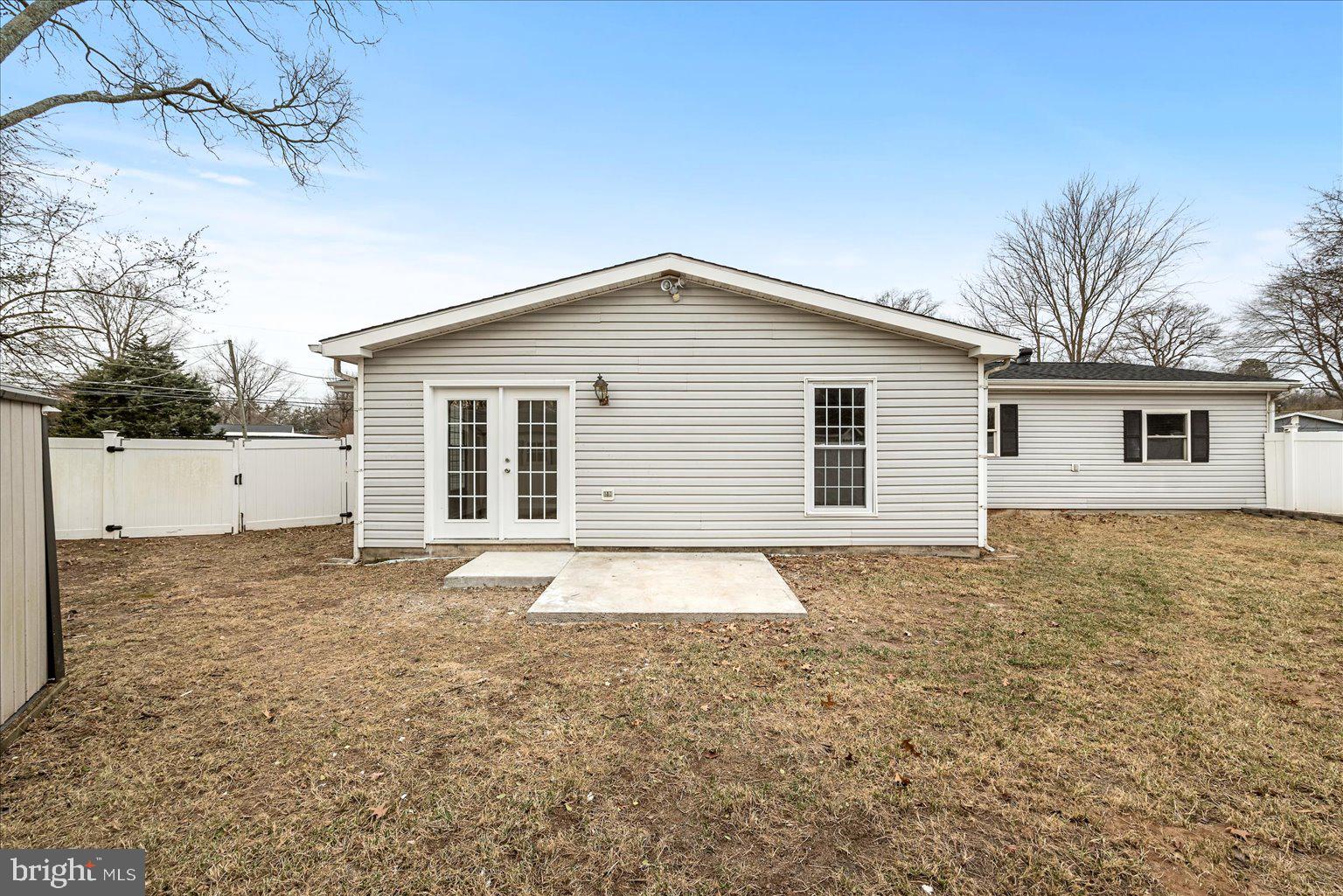 7931 Russell Road Alexandria, VA 22309 - Photo 14 of 16 a view of a house with a yard and garage