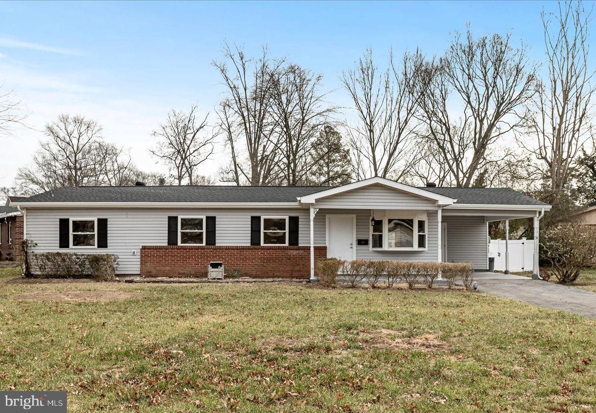 7931 Russell Road Alexandria, VA 22309 - Photo 15 of 16 a front view of house with yard and trees around