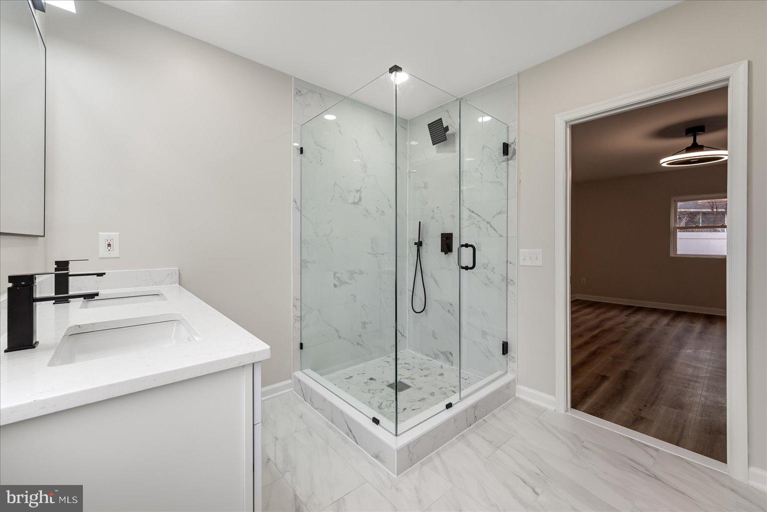 7931 Russell Road Alexandria, VA 22309 - Photo 9 of 16 a bathroom with a shower sink and mirror