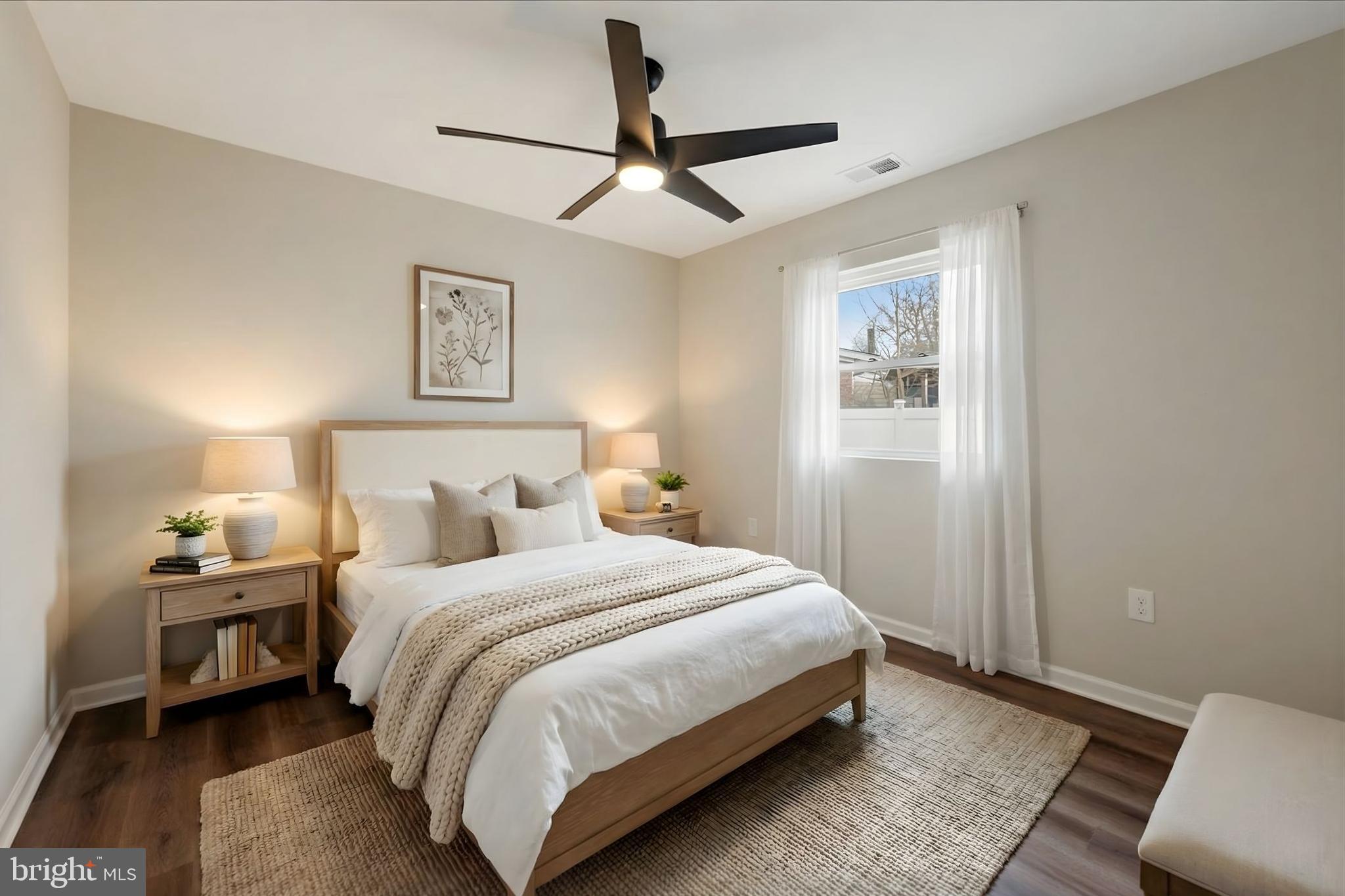 7931 Russell Road Alexandria, VA 22309 - Photo 10 of 16 a bedroom with a bed chandelier and a window