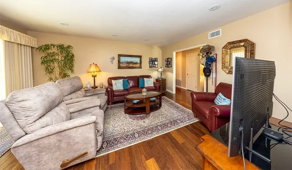 a living room with furniture and a couch
