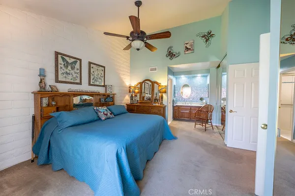 a bedroom with a bed and furniture