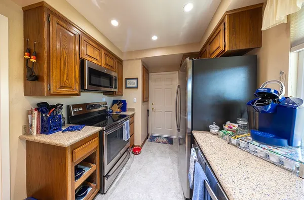 a kitchen with a sink stove and refrigerator
