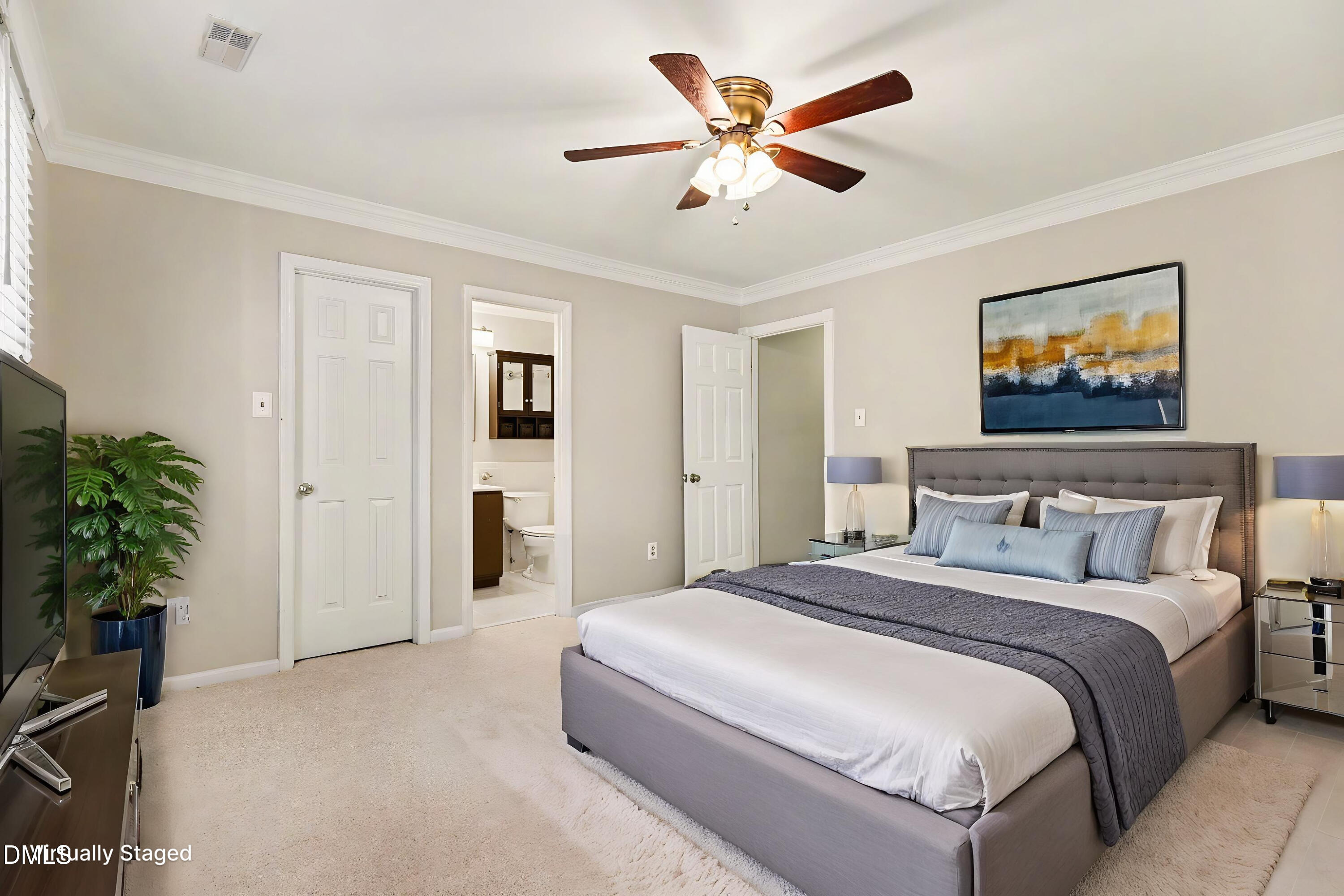 5645 Hamstead Crossing Raleigh, NC 27612 - Photo 6 of 35 a bedroom with a large bed and a chandelier